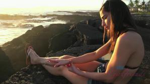 Emily enjoys the shoreline, and a sunset.